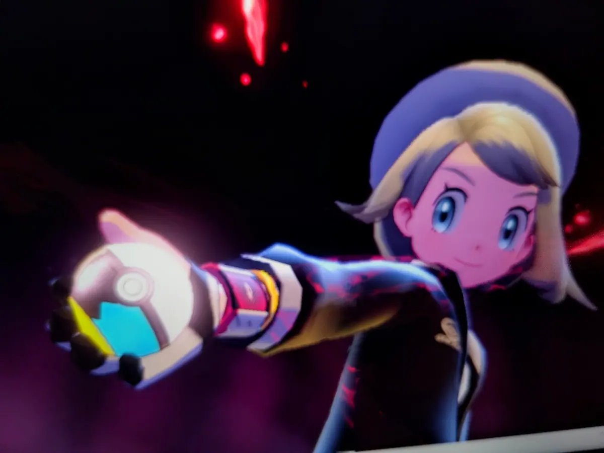 An anime character holding a glowing object in a dark scene.